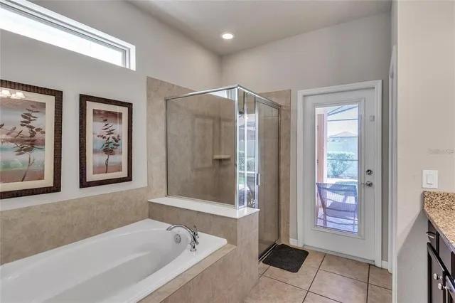 a bathroom with a bathtub and a shower