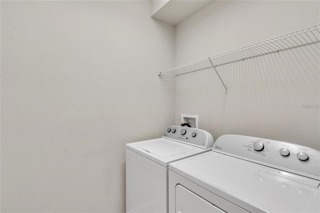 8916 Rhodes Street Kissimmee, FL 34747 - Photo 25 of 34 a utility room with dryer and washer