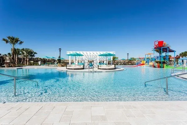 a view of swimming pool with a yard