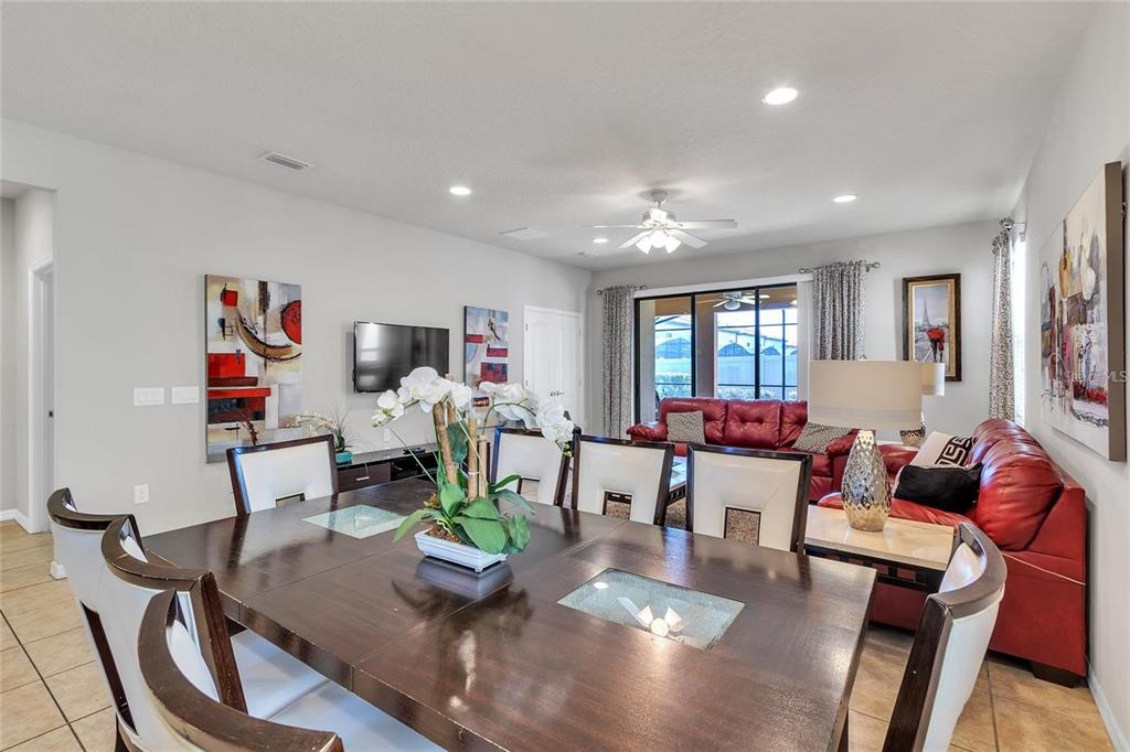 8916 Rhodes Street Kissimmee, FL 34747 - Photo 6 of 34 a living room with furniture and wooden floor