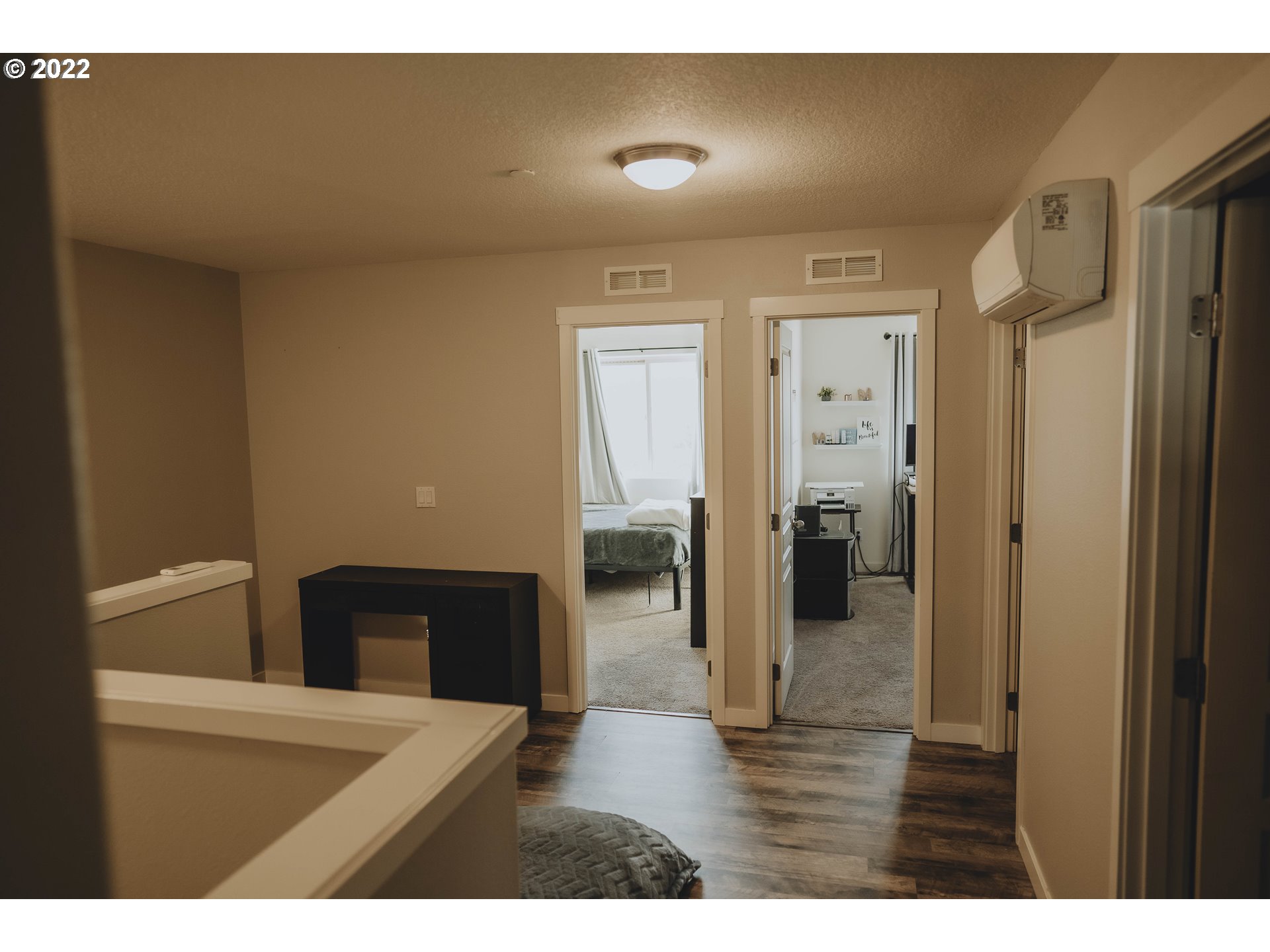 249 North 43rd Place Ridgefield, WA 98642 - Photo 32 of 32 a view of a hallway with wooden floor and a bathroom