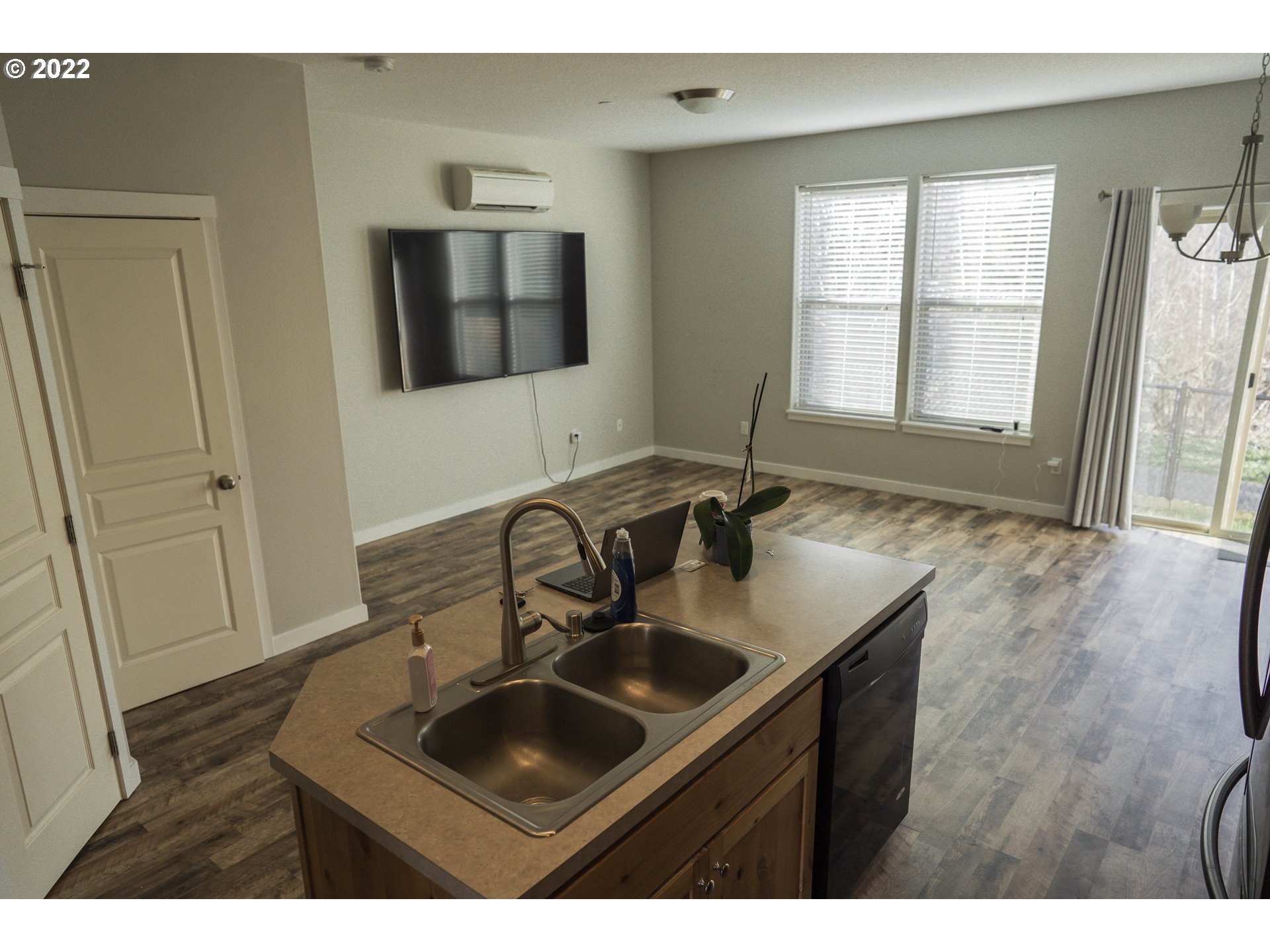 249 North 43rd Place Ridgefield, WA 98642 - Photo 4 of 32 a kitchen with a sink cabinets and window