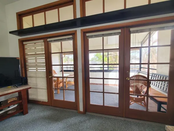 a bedroom with two beds and a window