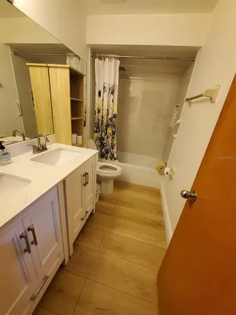 a bedroom with a bed and a desk