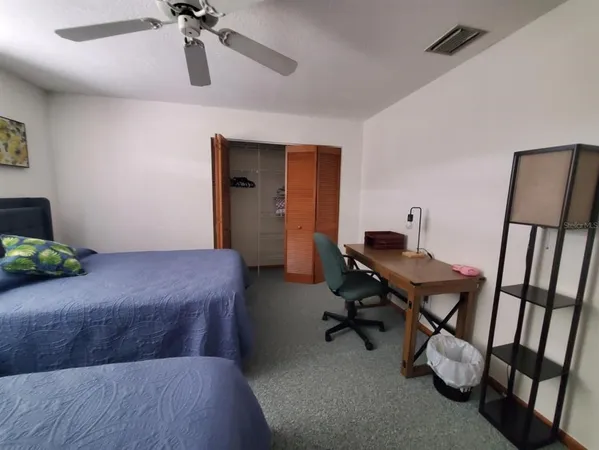 a kitchen with a stove a refrigerator and a table