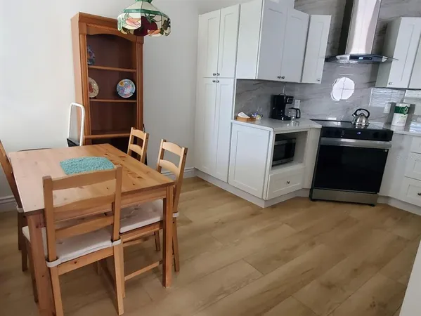 a kitchen with a stove and a refrigerator