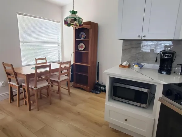 a kitchen with a sink cabinets and appliances