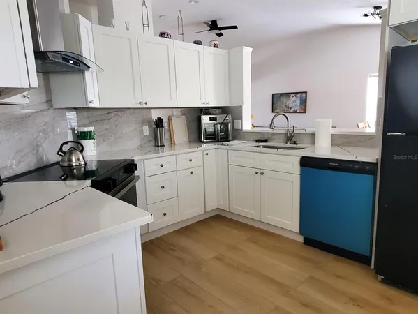 a bedroom with furniture and window