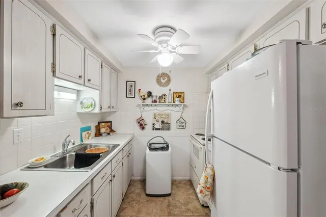 a kitchen with a cabinets and a stove top oven