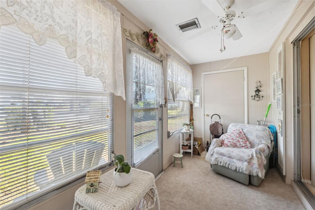 4222 Richmere Drive, Unit 4222 New Port Richey, FL 34652 - Photo 24 of 36 a bedroom with furniture and a large window