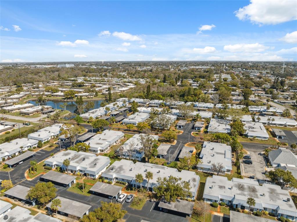 4222 Richmere Drive, Unit 4222 New Port Richey, FL 34652 - Photo 29 of 36 an aerial view of residential building with parking space
