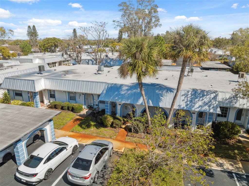 4222 Richmere Drive, Unit 4222 New Port Richey, FL 34652 - Photo 8 of 36 a front view of a house with garden and patio