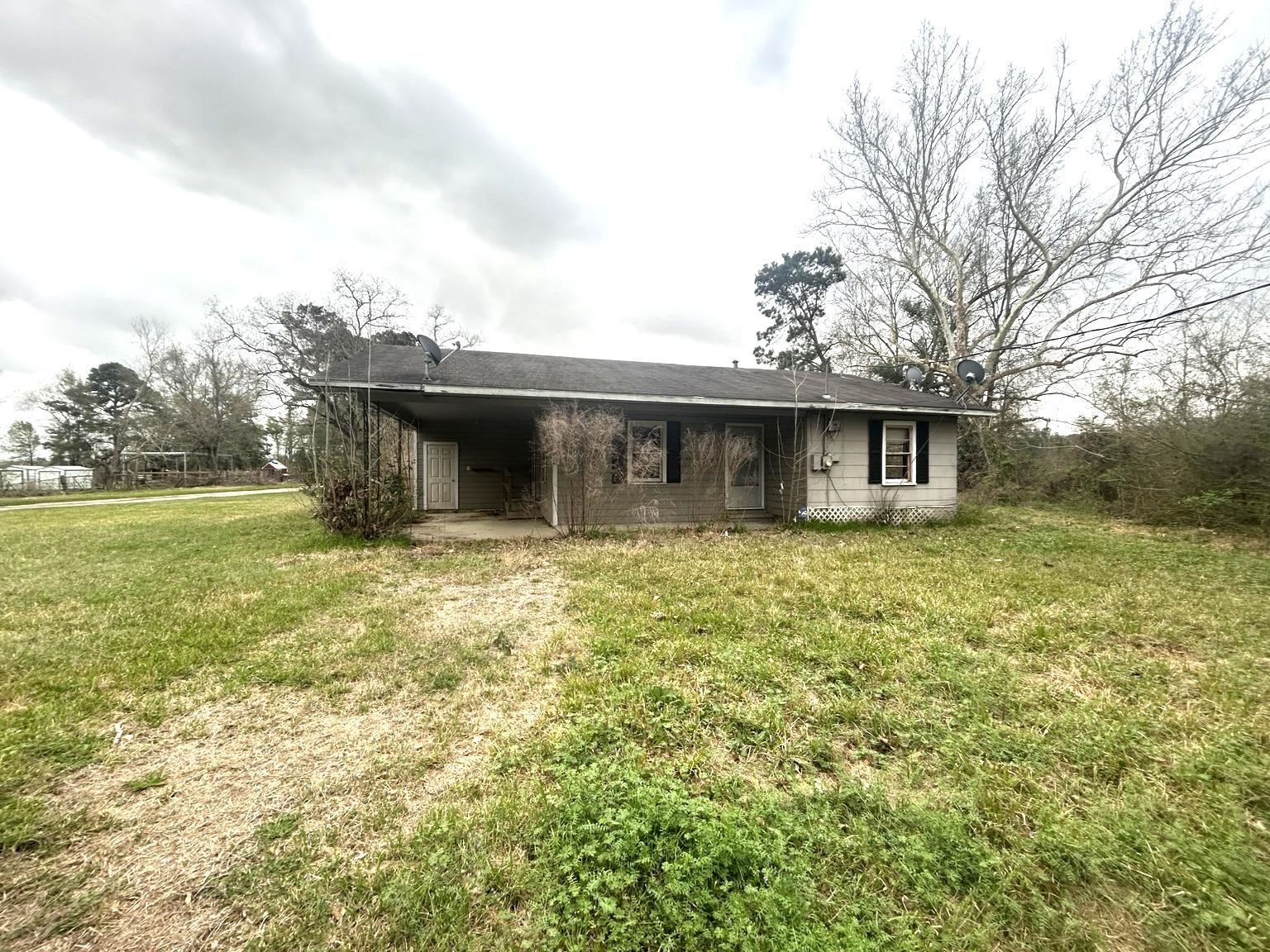 9122 Tulane Road Orange, TX 77630 - Photo 1 of 17 a view of a house with a backyard
