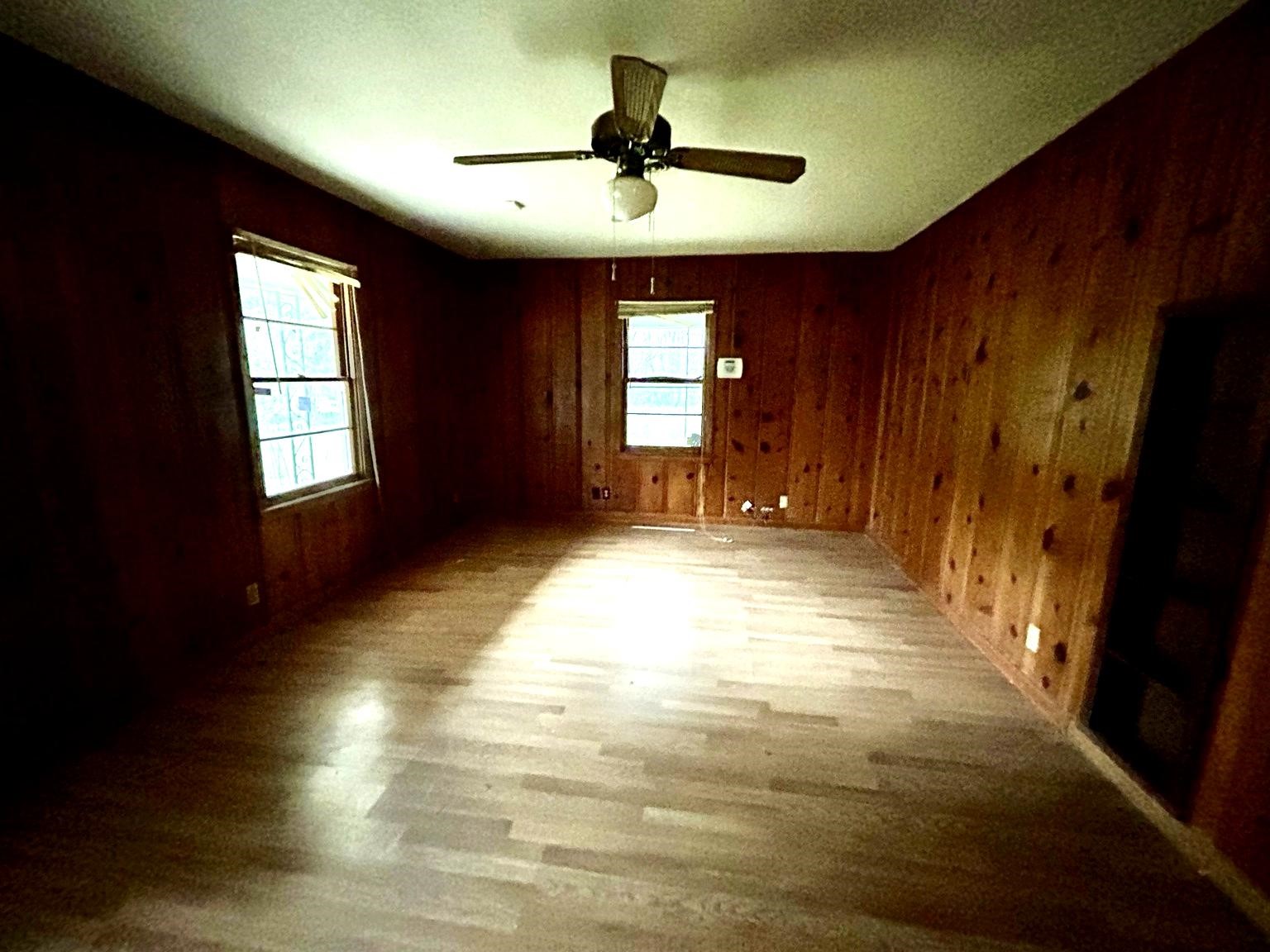 9122 Tulane Road Orange, TX 77630 - Photo 4 of 17 a view of empty room with window and hardwood floor