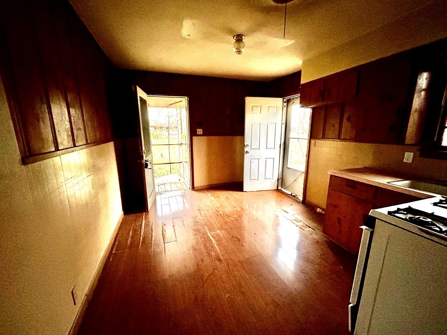 9122 Tulane Road Orange, TX 77630 - Photo 6 of 17 a view of a kitchen with wooden floor and electronic appliances