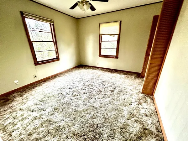 a view of an empty room and window