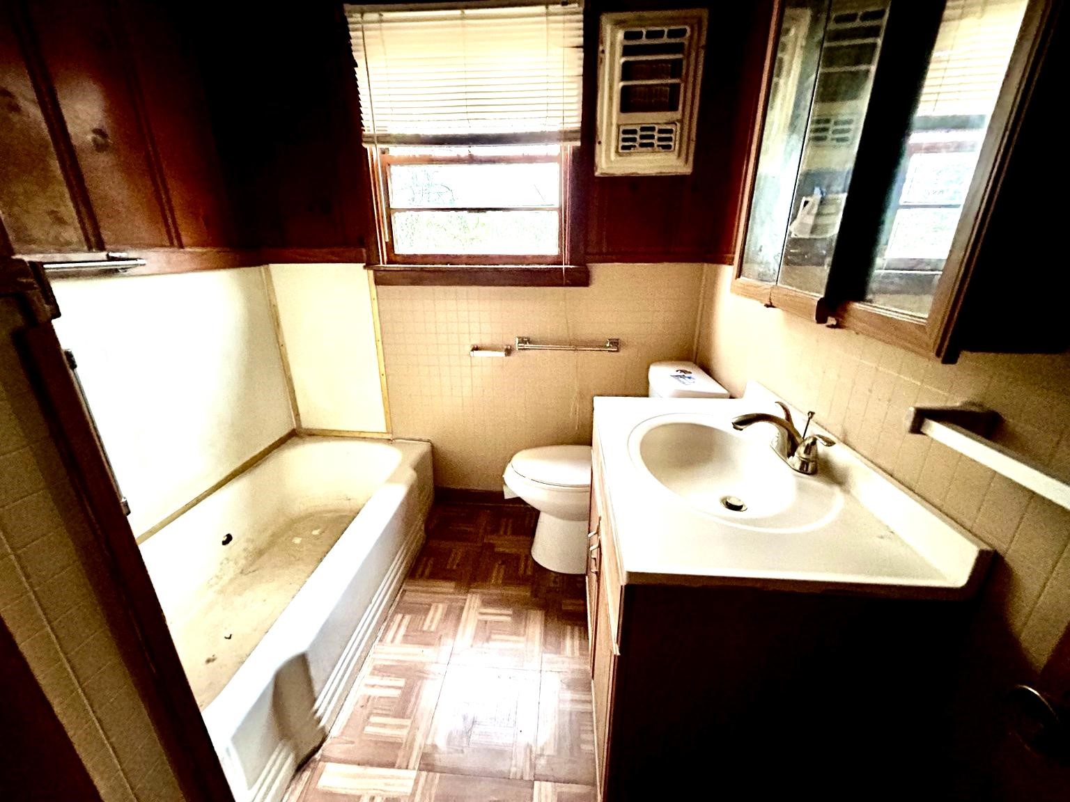 9122 Tulane Road Orange, TX 77630 - Photo 10 of 17 a bathroom with a sink toilet and a mirror