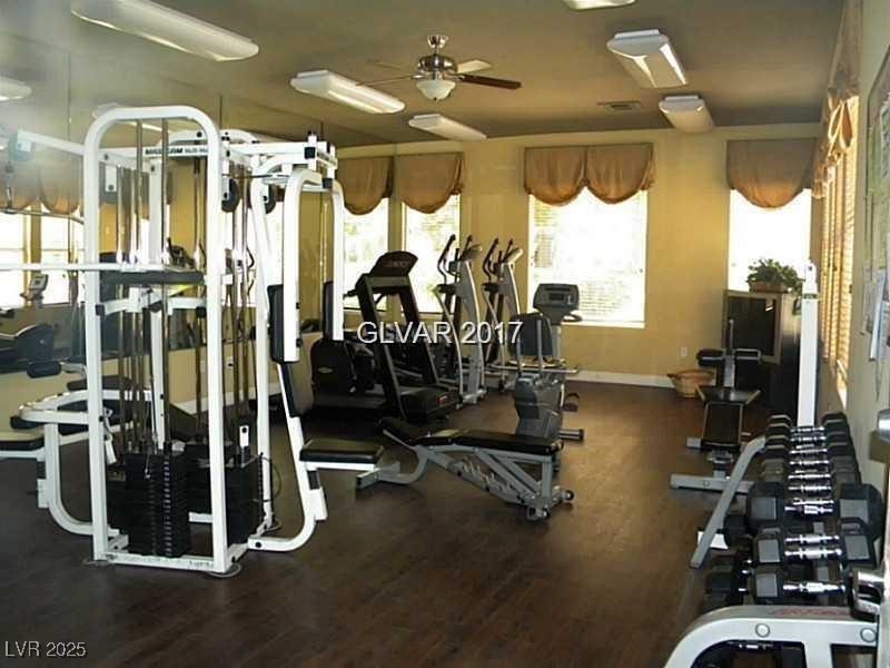 555 East Silverado Ranch Boulevard, Unit 1073 Las Vegas, NV 89183 - Photo 17 of 21 Gym with ceiling fan and wood finished floors