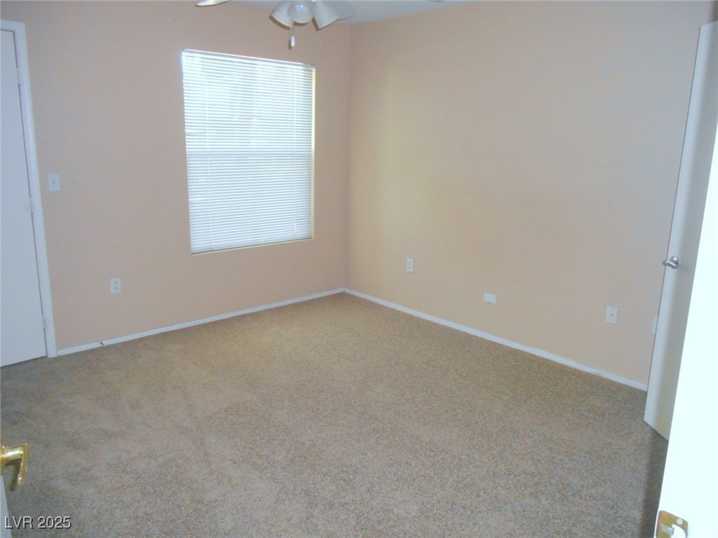 555 East Silverado Ranch Boulevard, Unit 1073 Las Vegas, NV 89183 - Photo 6 of 21 Carpeted empty room featuring a ceiling fan and baseboards