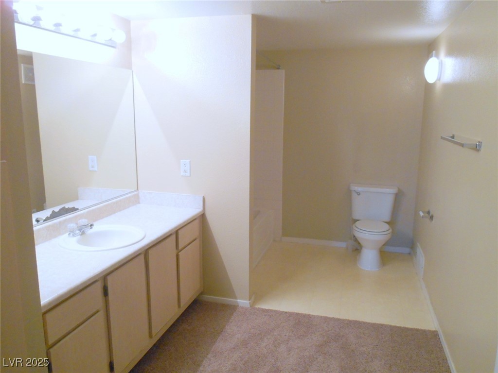 555 East Silverado Ranch Boulevard, Unit 1073 Las Vegas, NV 89183 - Photo 7 of 21 Full bath with vanity and shower combination