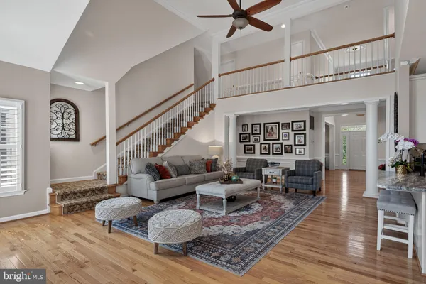 a view of a livingroom with furniture window and wooden floor