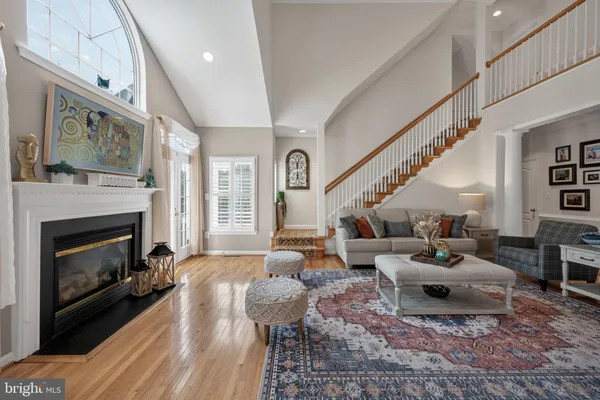 a kitchen with stainless steel appliances granite countertop a sink a stove and cabinets