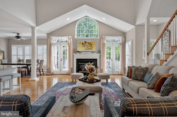 a bedroom with a bed rug and wooden floor