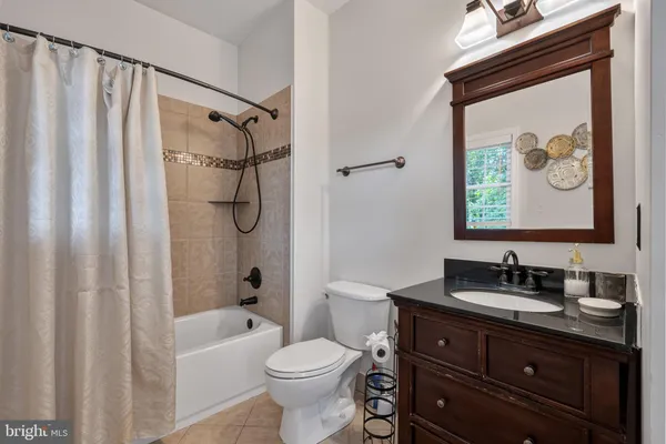 a room with furniture pool table and windows
