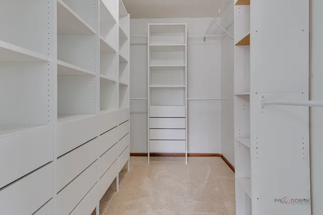 a view of an empty walk in closet