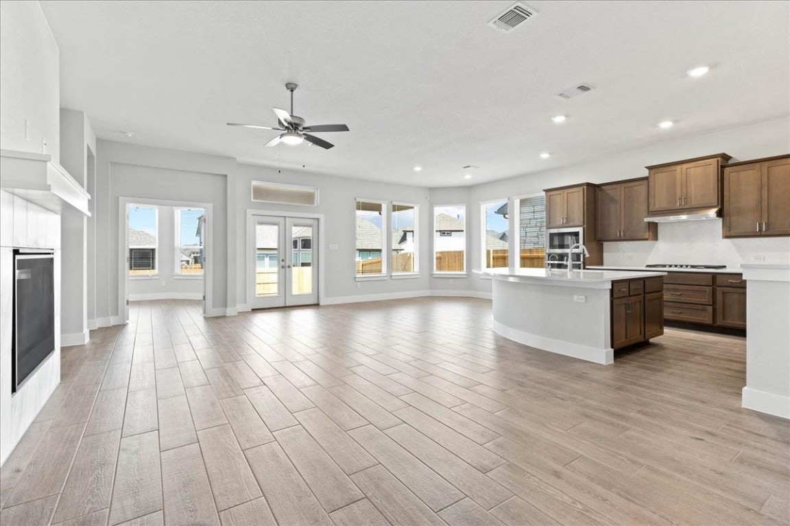 a view of kitchen with cabinets and wooden floor