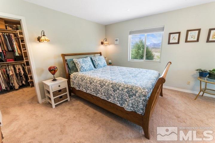 5155 Pasture View Road Reno, NV 89510 - Photo 13 of 21 a bedroom with a bed and a window