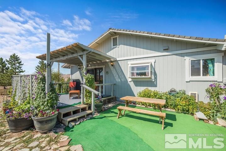 5155 Pasture View Road Reno, NV 89510 - Photo 19 of 21 a front view of a house with garden
