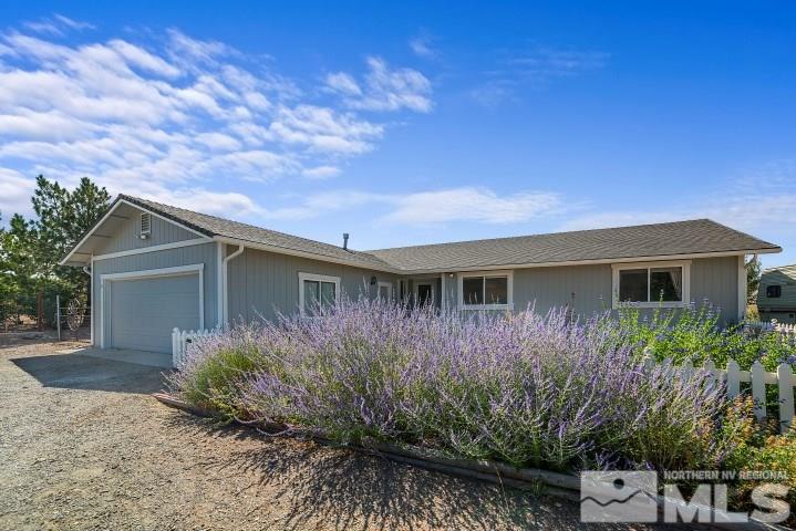 5155 Pasture View Road Reno, NV 89510 - Photo 20 of 21 a front view of house with yard and trees around