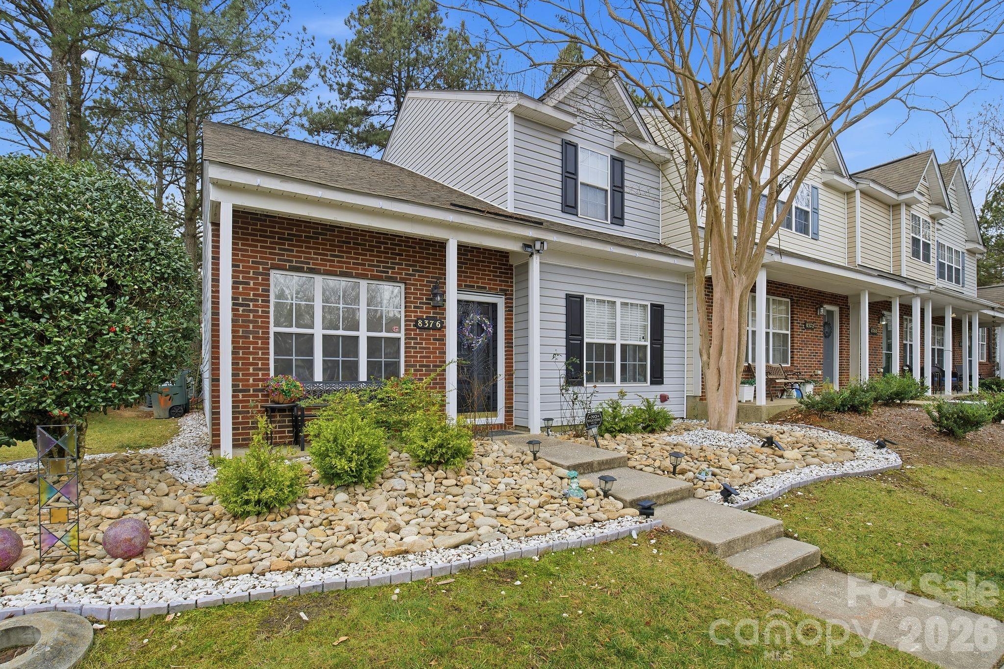 8376 Rudolph Road Charlotte, NC 28216 - Photo 2 of 28 a front view of a house with garden