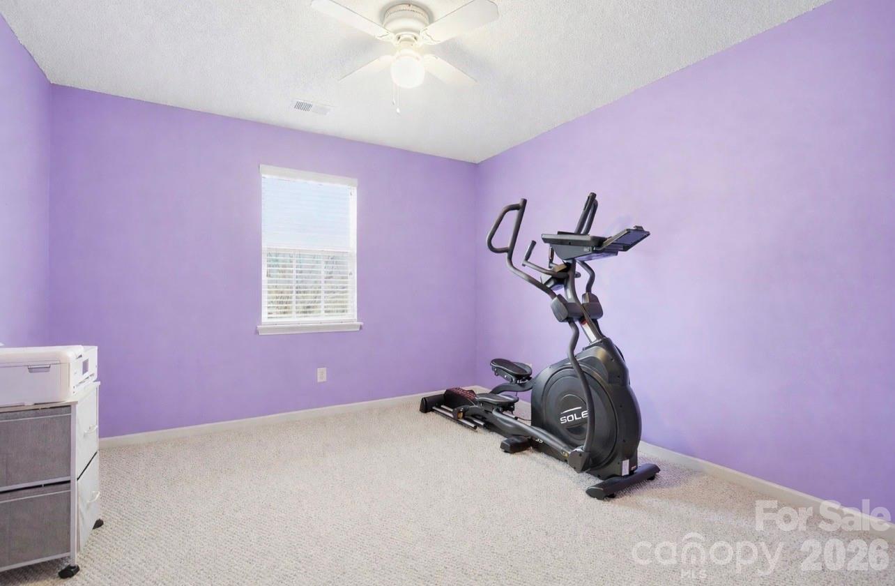8376 Rudolph Road Charlotte, NC 28216 - Photo 23 of 28 a room with gym equipment