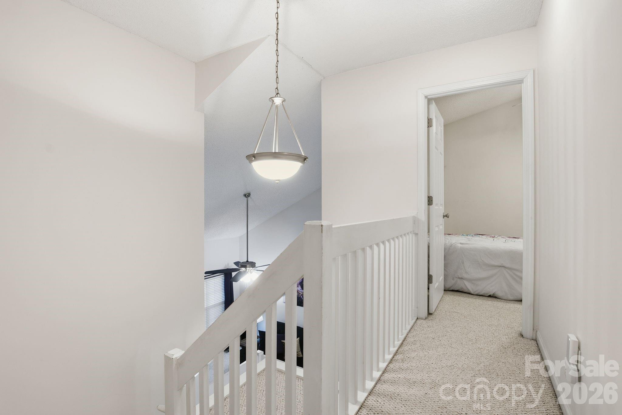 8376 Rudolph Road Charlotte, NC 28216 - Photo 25 of 28 a view of a hallway with a couch