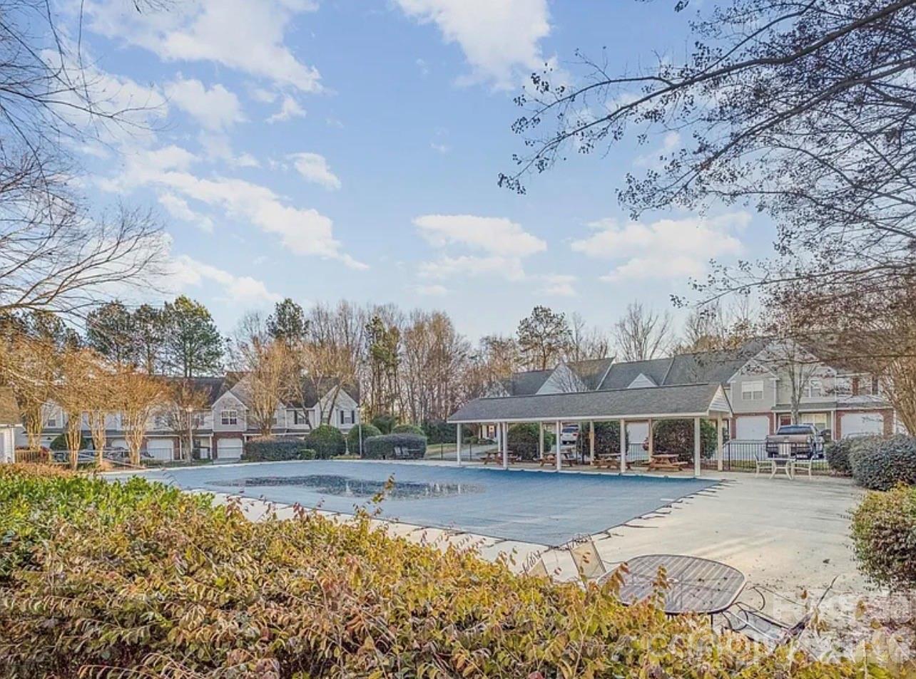 8376 Rudolph Road Charlotte, NC 28216 - Photo 26 of 28 a front view of a house with a garden