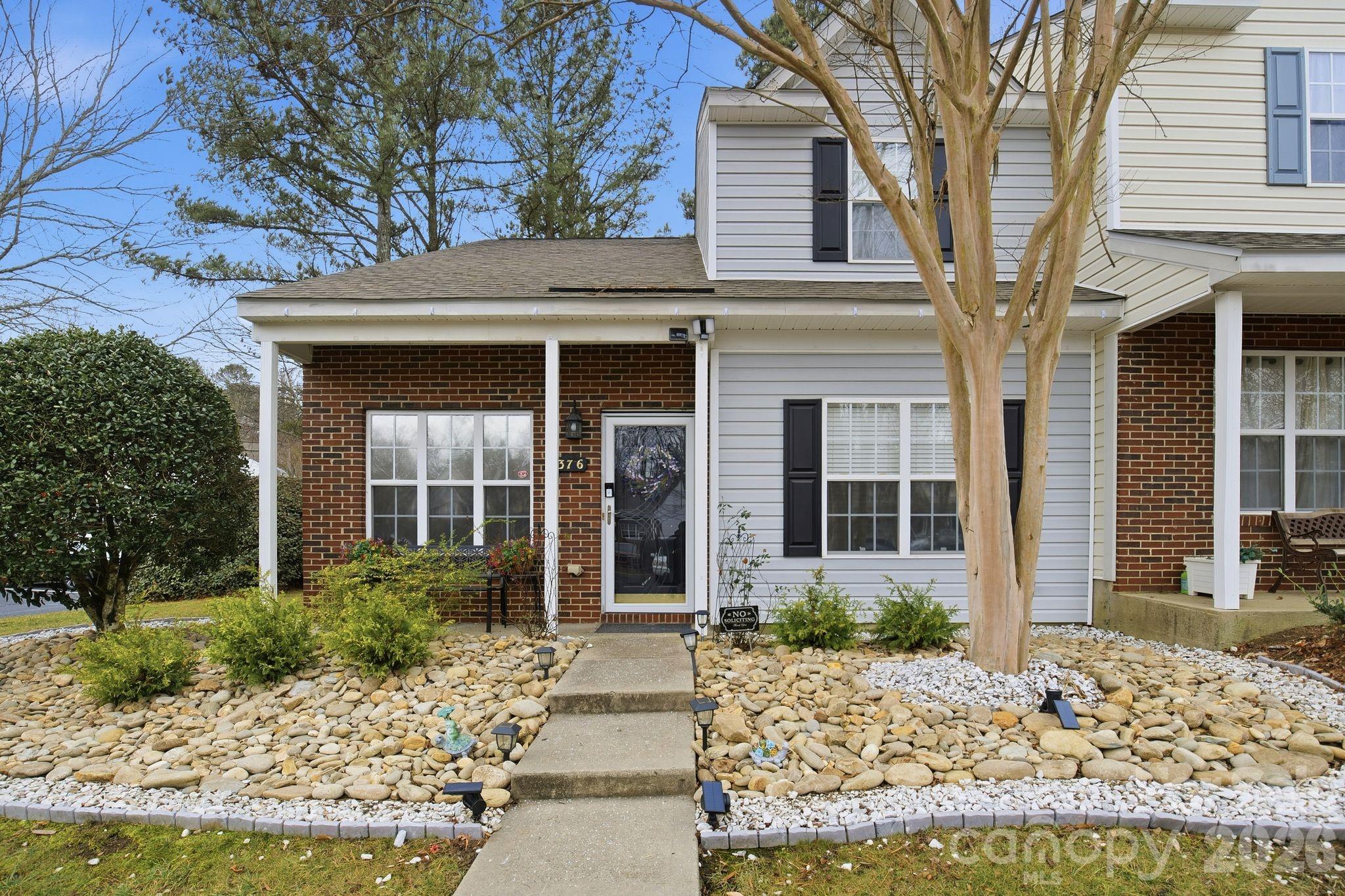 8376 Rudolph Road Charlotte, NC 28216 - Photo 3 of 28 a front view of a house with garden