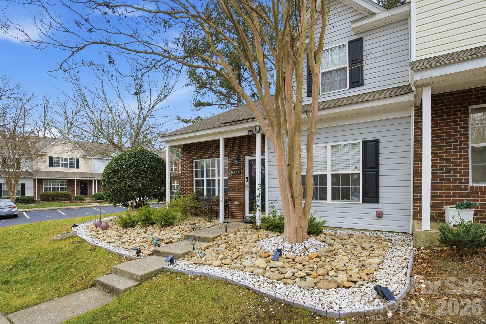 8376 Rudolph Road Charlotte, NC 28216 - Photo 5 of 28 a front view of a house with garden