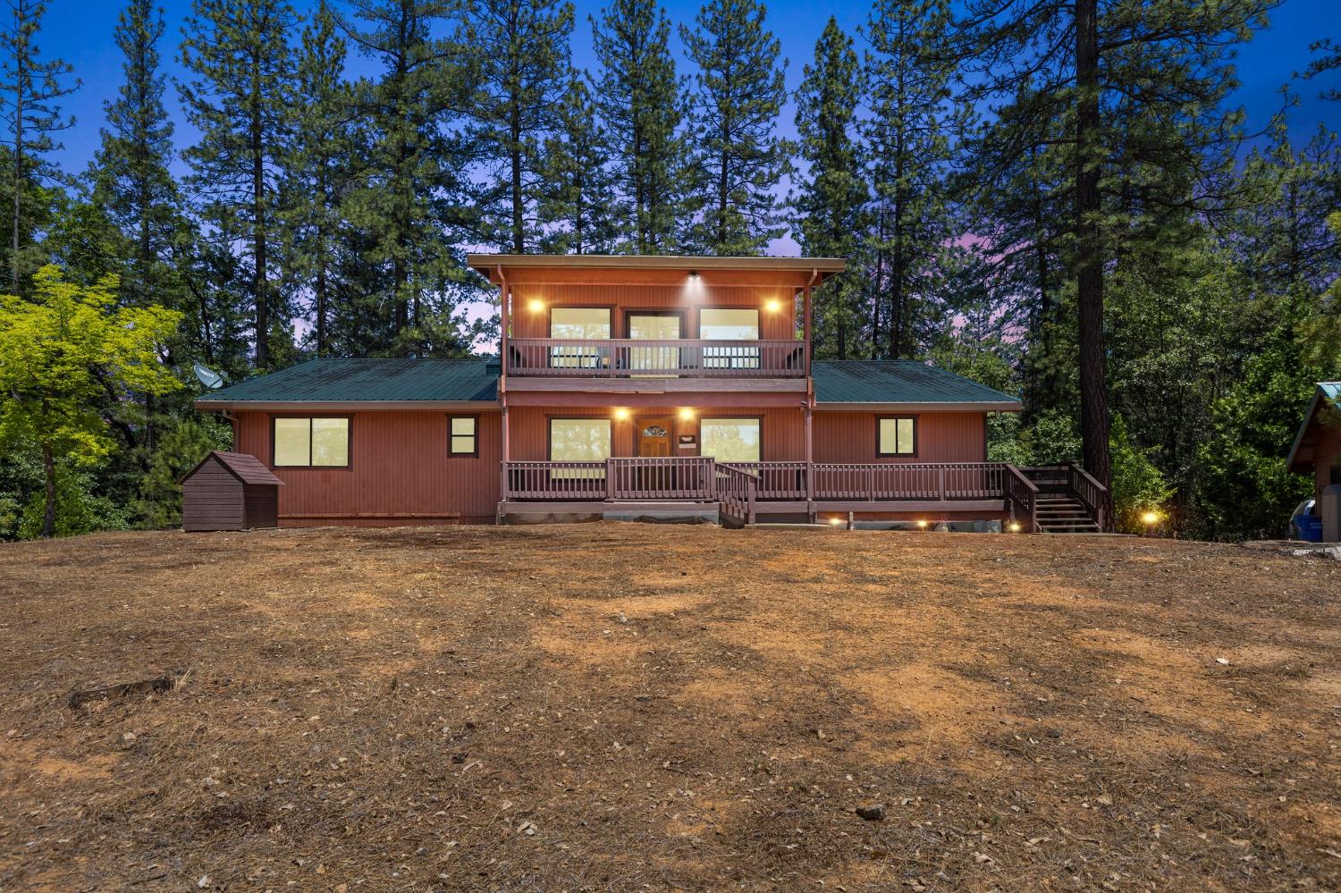 a view of a house with a yard and garage