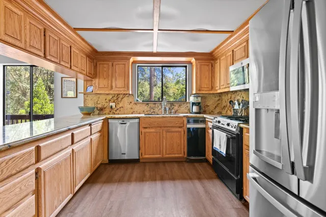 a dining room with furniture and a rug