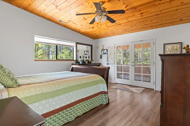 a view of a backyard with swimming pool