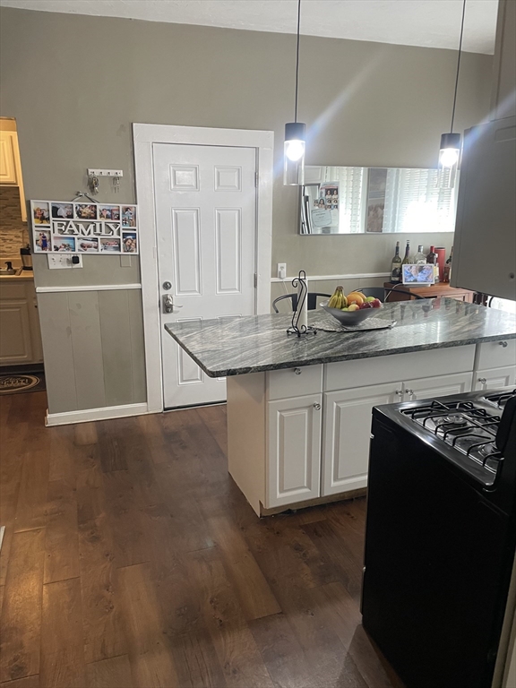 58 Brett Street, Unit 1 Brockton, MA 02301 - Photo 2 of 7 a kitchen with granite countertop a sink stove and cabinets