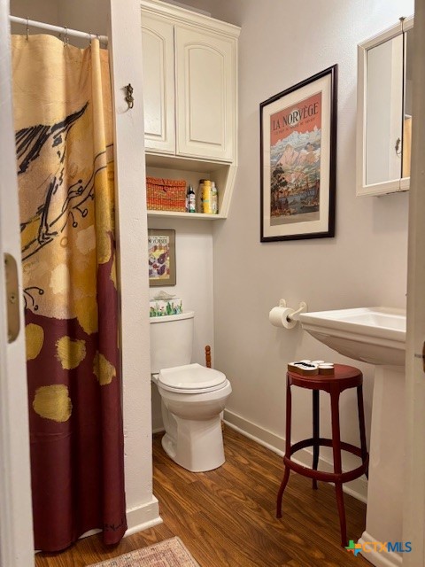 1408 Bridge Street Gatesville, TX 76528 - Photo 15 of 24 a bathroom with a toilet and a shower