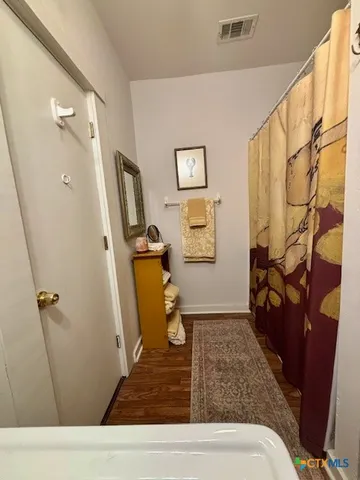 a bathroom with a sink and mirror