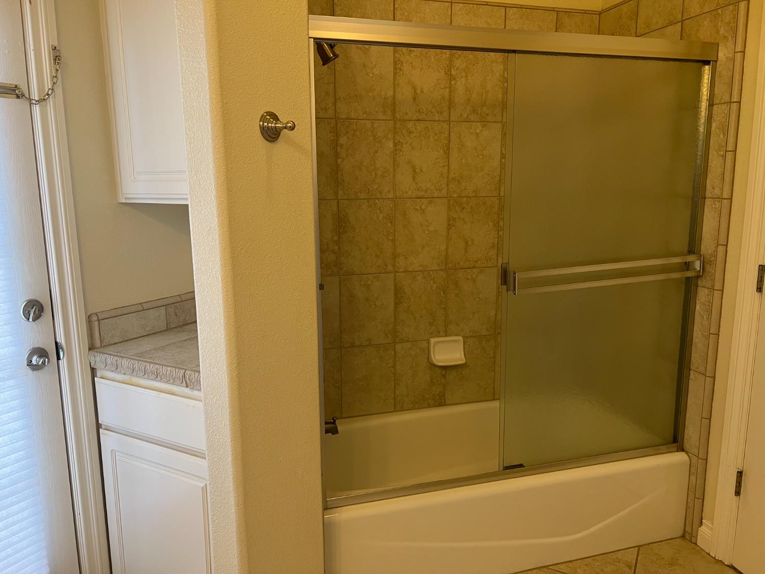 1046 Lords Court Lemoore, CA 93245 - Photo 16 of 23 a bathroom with a shower