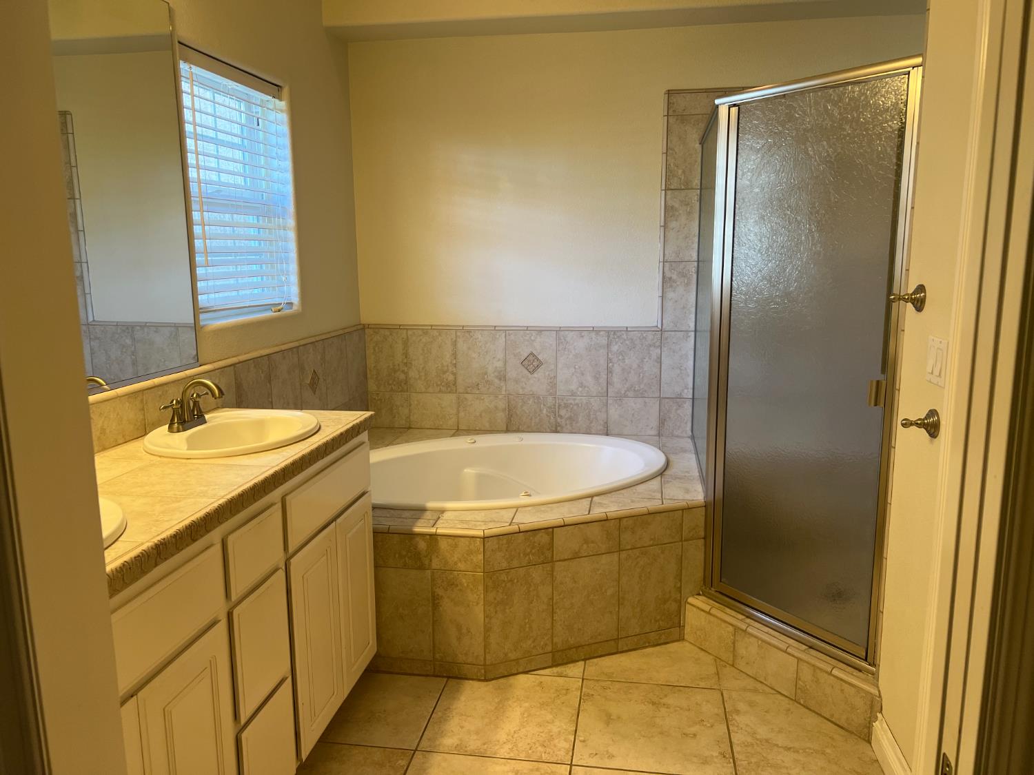 1046 Lords Court Lemoore, CA 93245 - Photo 18 of 23 a bathroom with a granite countertop sink and washing machine