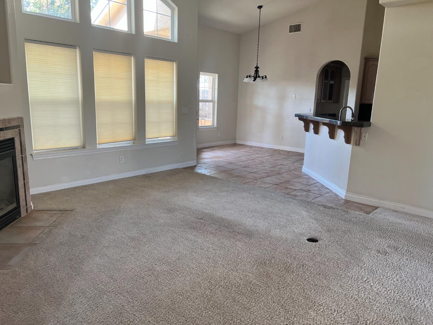 1046 Lords Court Lemoore, CA 93245 - Photo 4 of 23 a view of a livingroom with workspace and a window