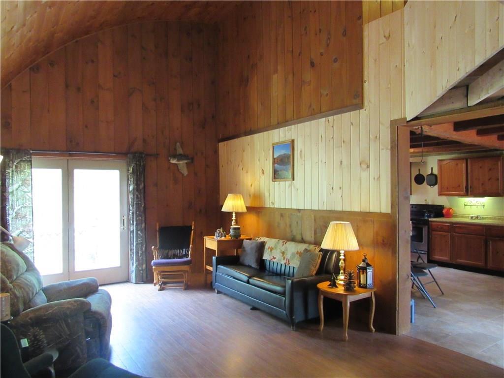 141 Meeting House Road Solon, ME 04979 - Photo 9 of 24 Living Room with Glass Door to Deck