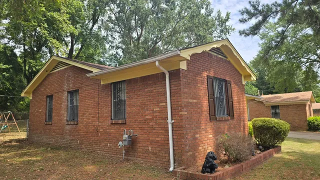 a front view of a house with yard